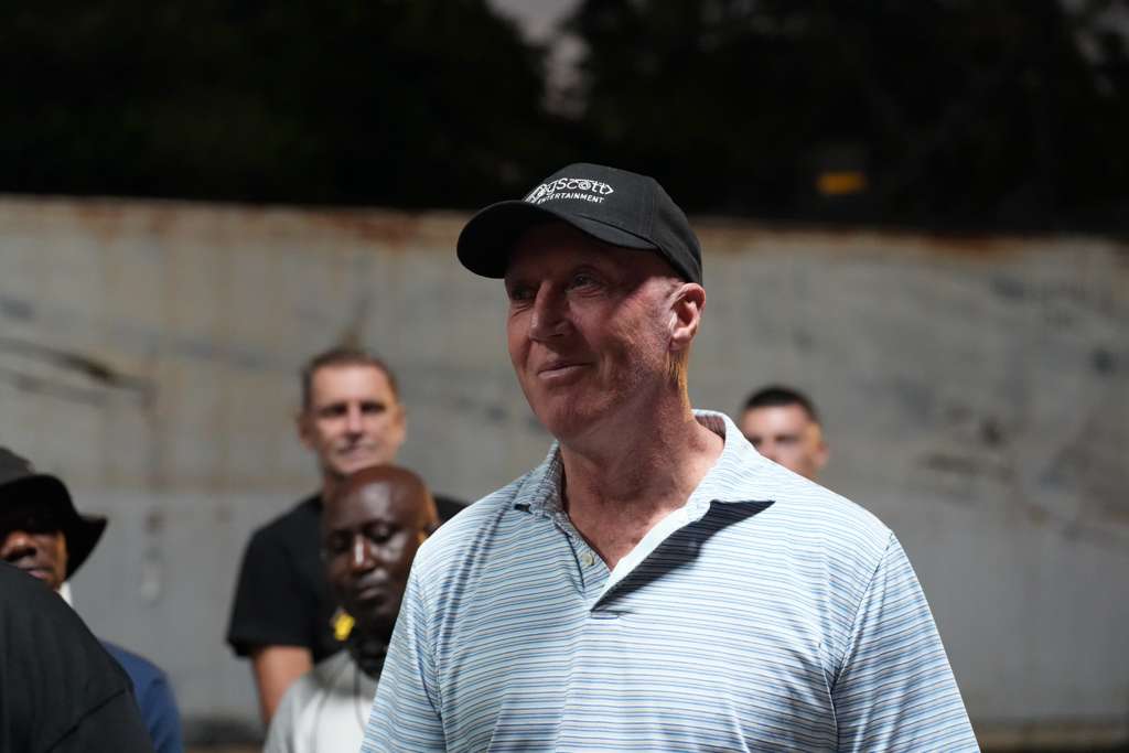 Producer in a KeyScott Entertainment cap on location